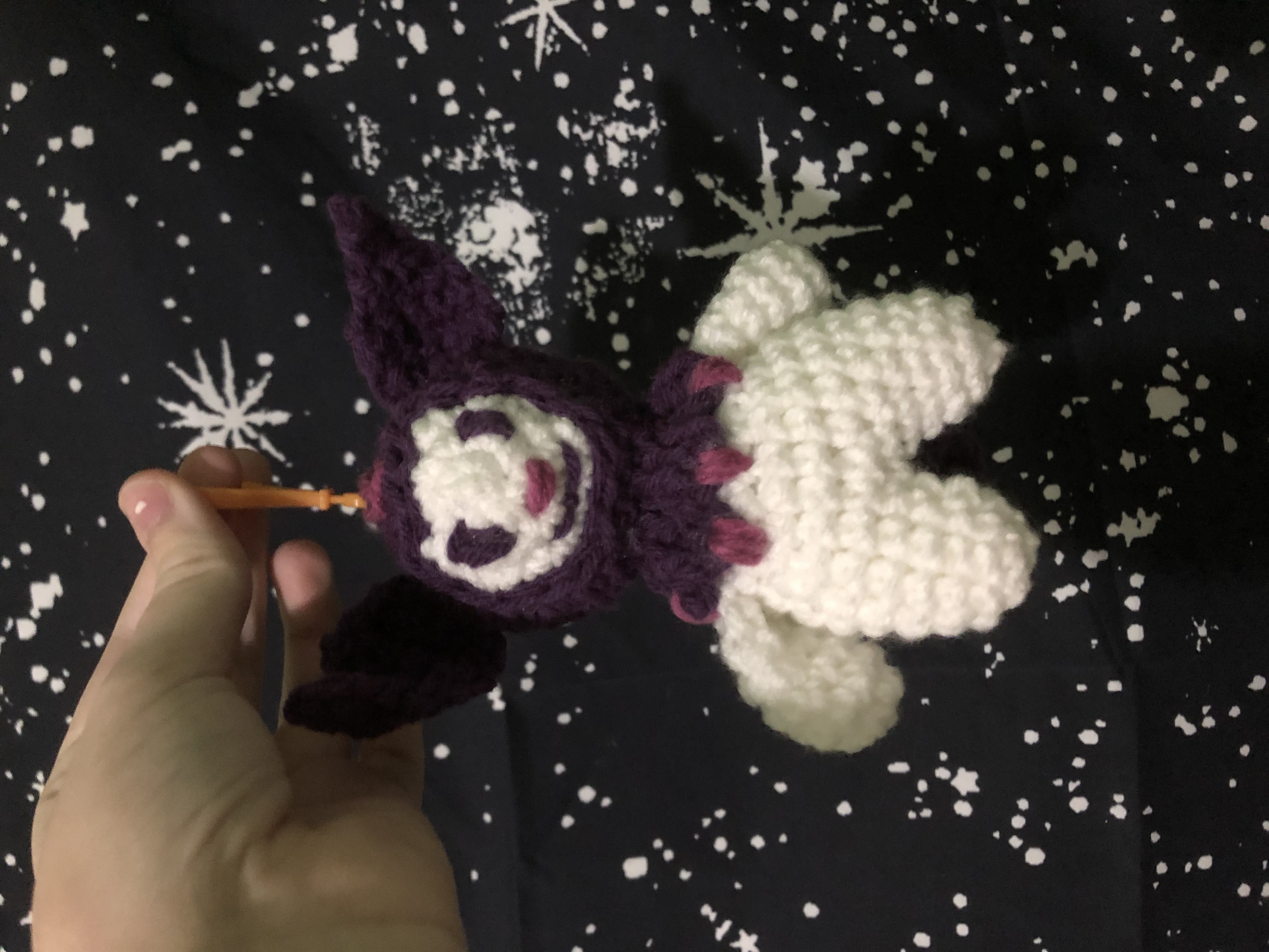 An amigurumi Kuromi keychain